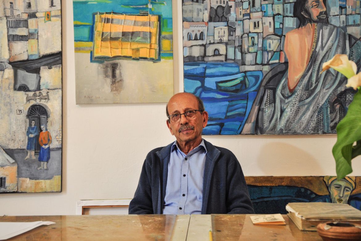 Abed Abdi sitting in his studio