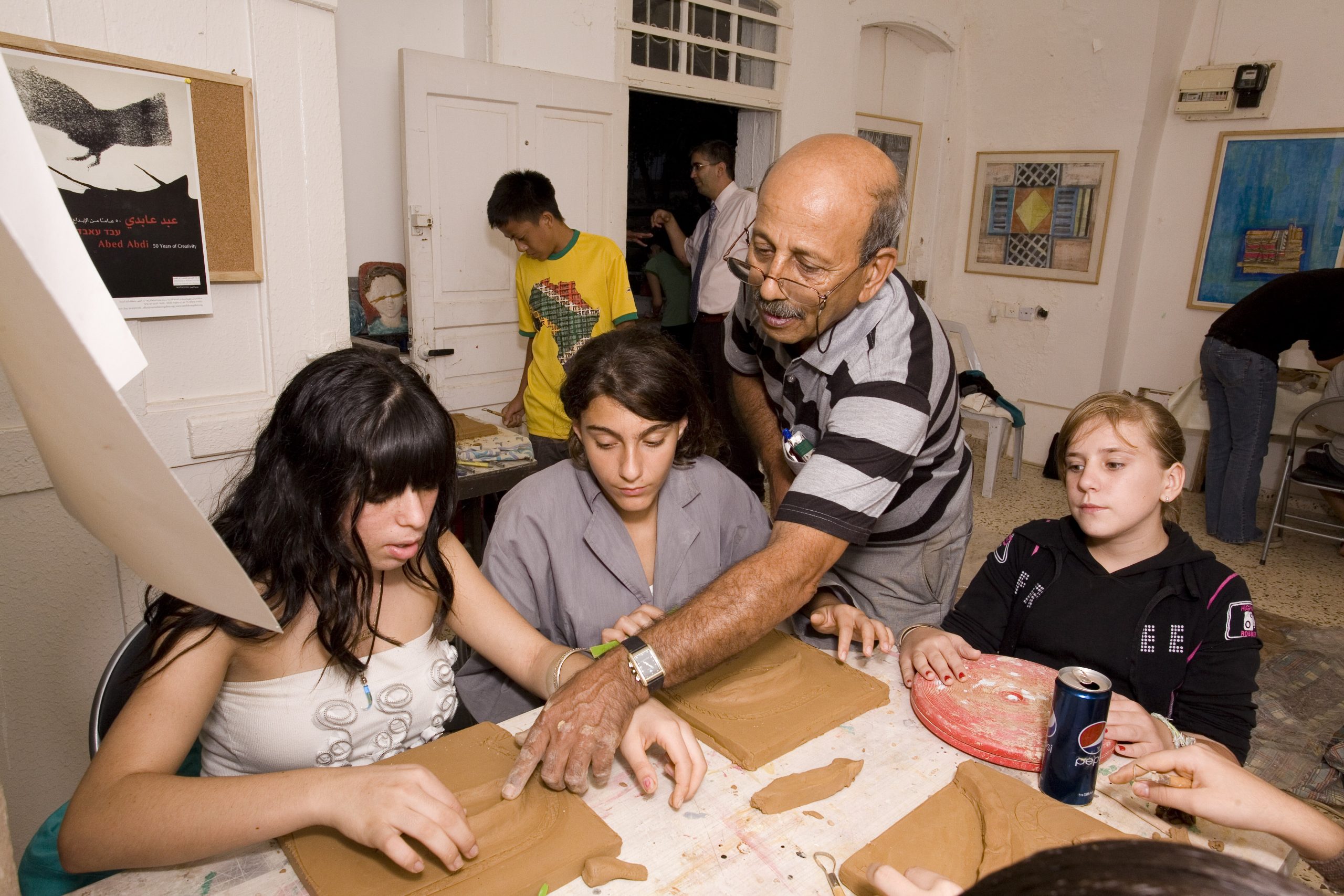 Abed Abdi with his art students, 2010